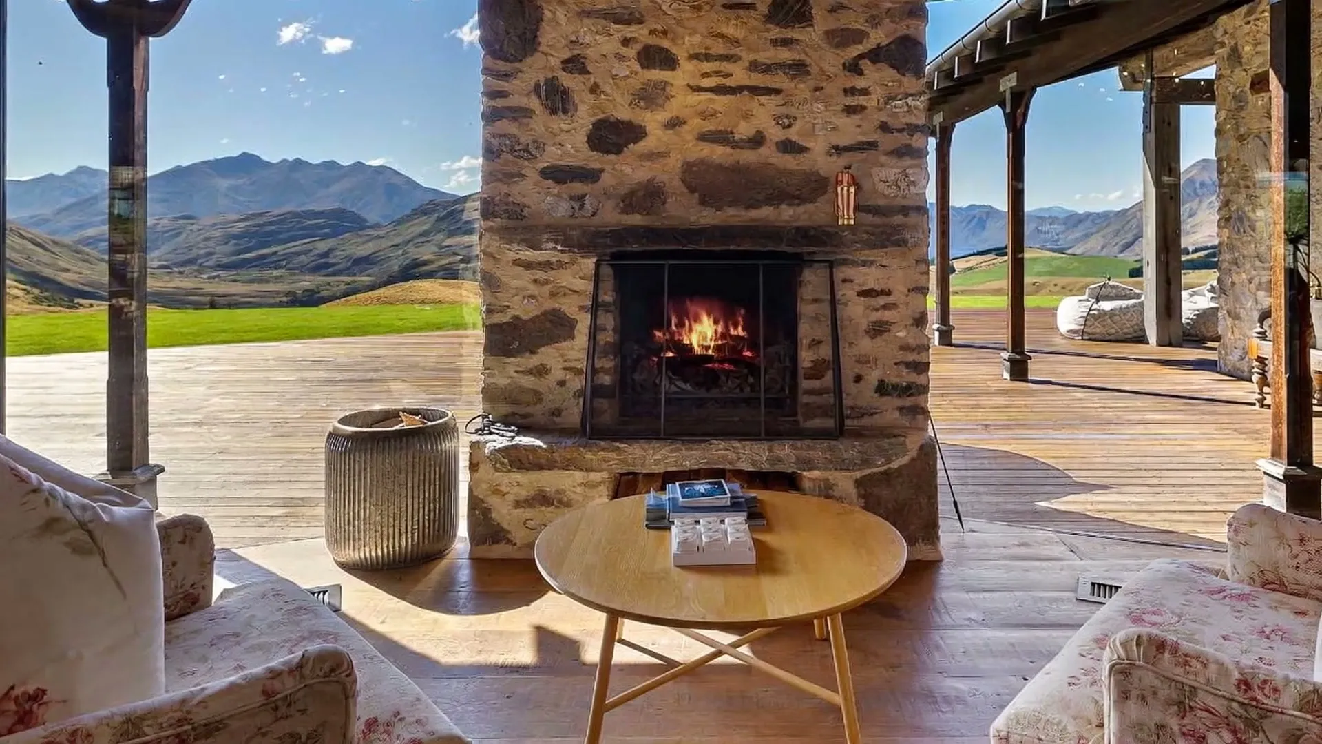 Outdoor fireplace on the veranda — frame from the Verdan property film